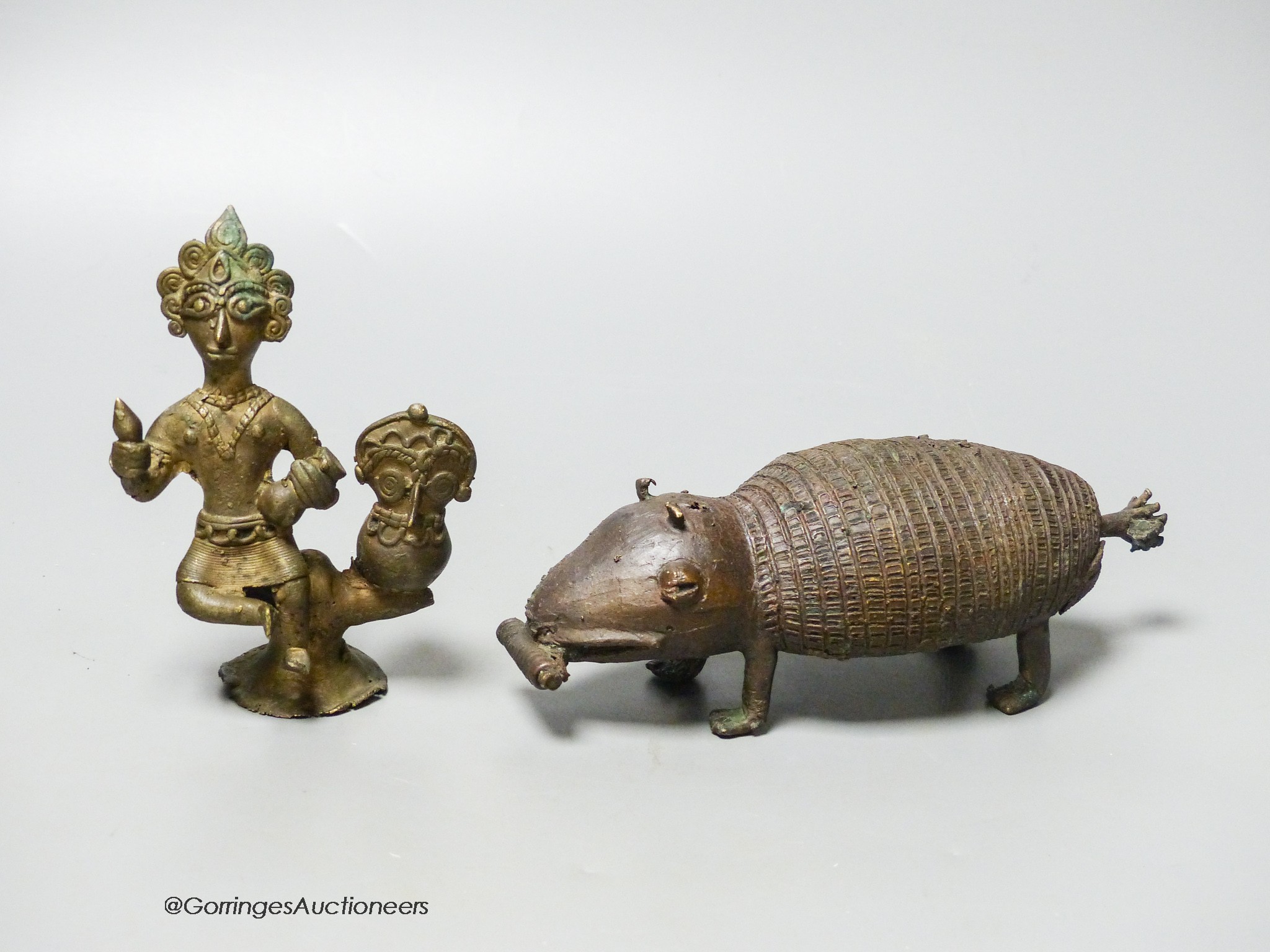 An Indian brass model of an armadillo and a similar figure